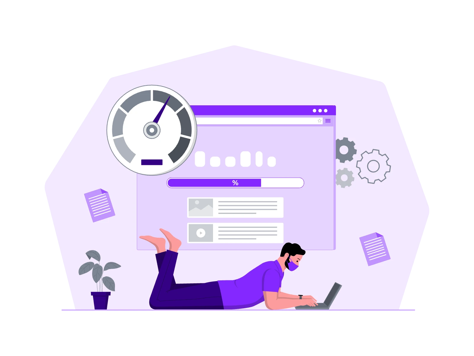 A man lying on the floor, focused on working on his laptop.